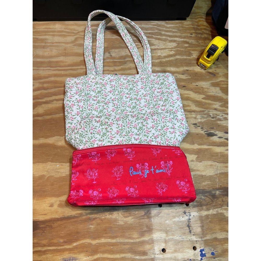 White purse with pink flowers with Lancôme case